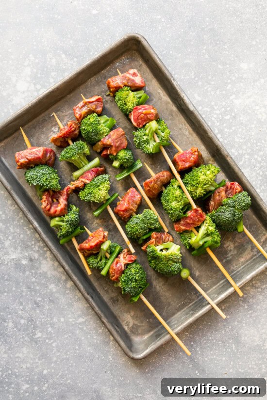 Thread the beef, broccoli and scallions on the skewers.