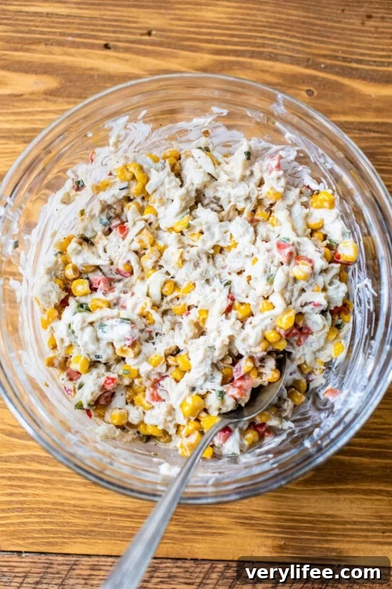 crab corn and cream cheese in a bowl