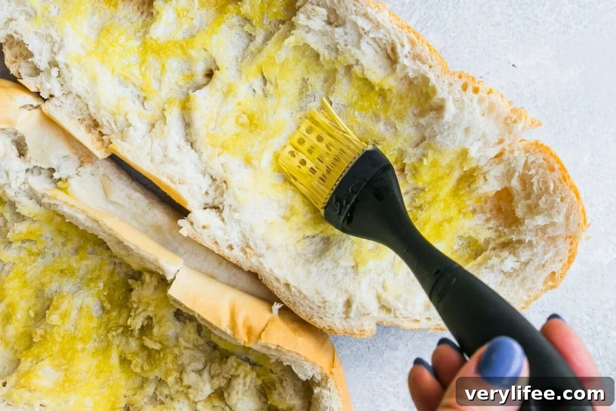 5 Olive Oils Worth Buying in 2024 7 Scoop out the inside of the bread and brush with olive oil.