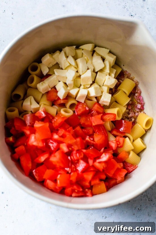 Bruschetta Pasta Salad with Tomato, Basil and Mozzarella 7 Add tomatoes and mozzarella to the pasta.