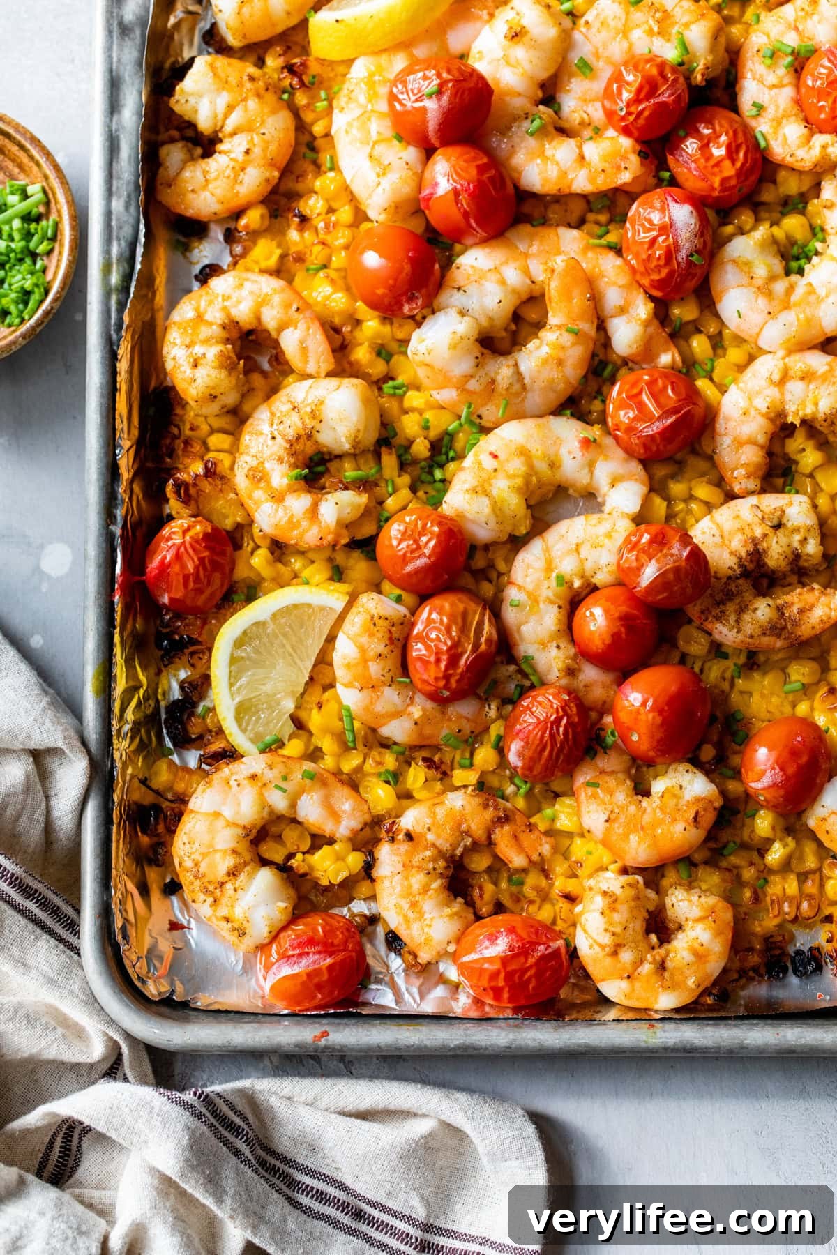 Old Bay Sheet Pan Shrimp with Corn and Tomatoes