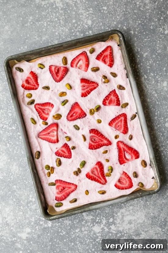 Frozen Strawberry Yogurt Bark on a sheet pan