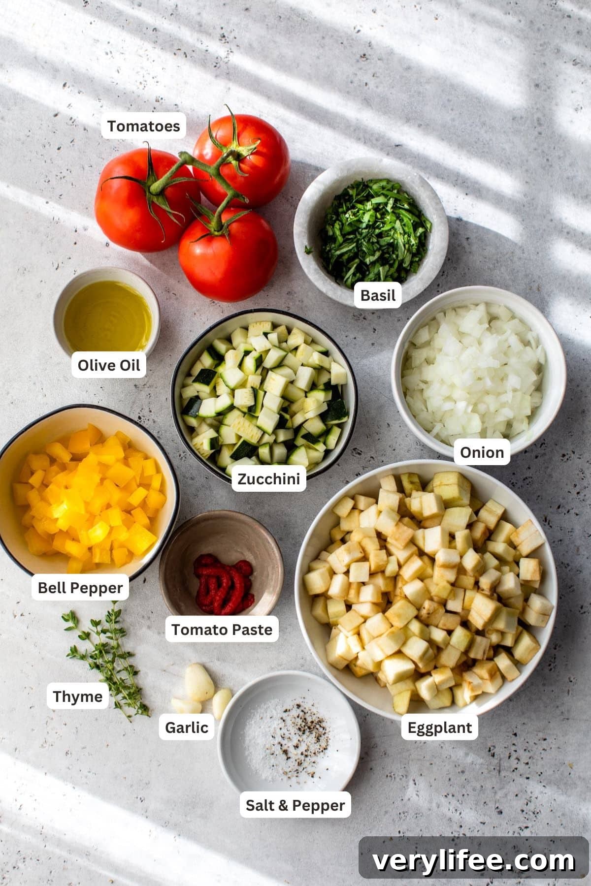 Classic French Ratatouille Recipe 4 Ingredients for ratatouille on a marble counter.