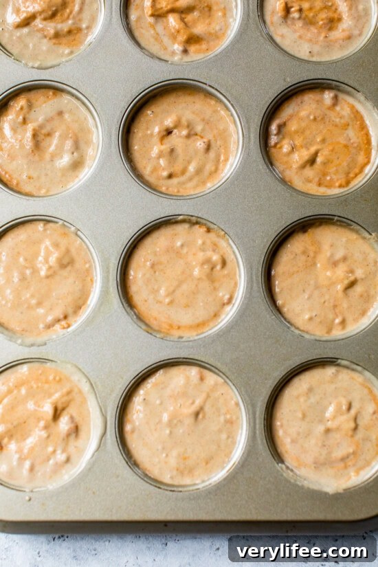 Fluffy Pumpkin Pancake Muffins Recipe for Fall Breakfast 8 Pumpkin Pancake Muffins in muffin tin