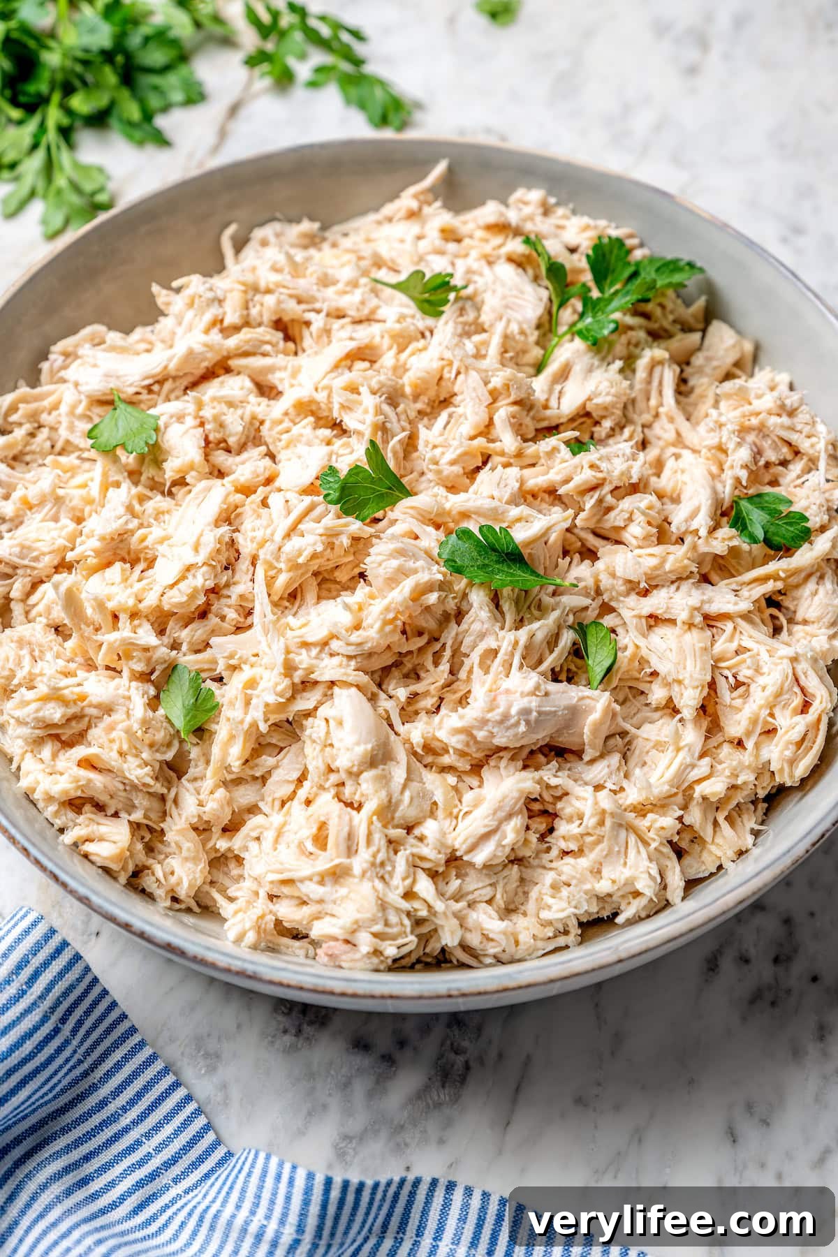 Bowl of crockpot shredded chicken
