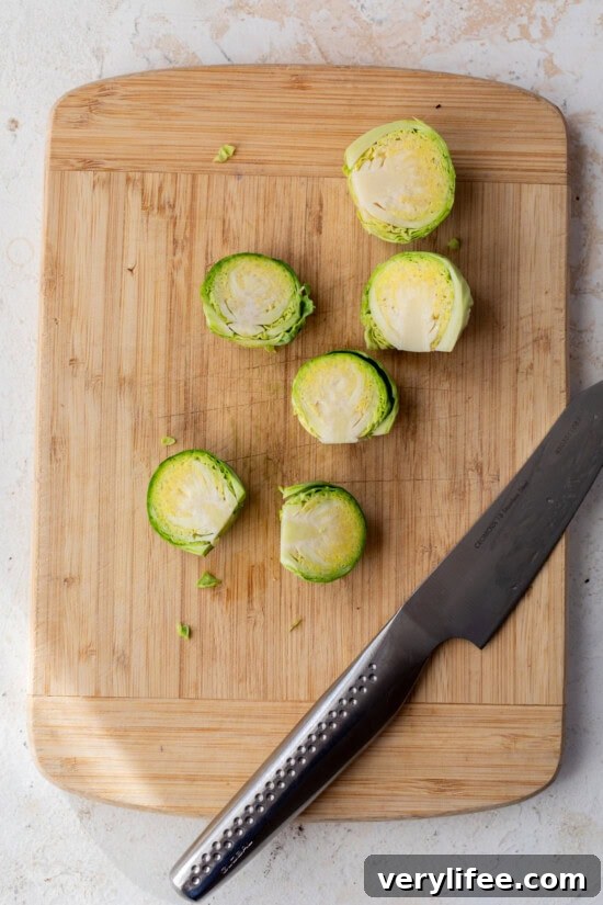 Cut the brussels sprouts in half.