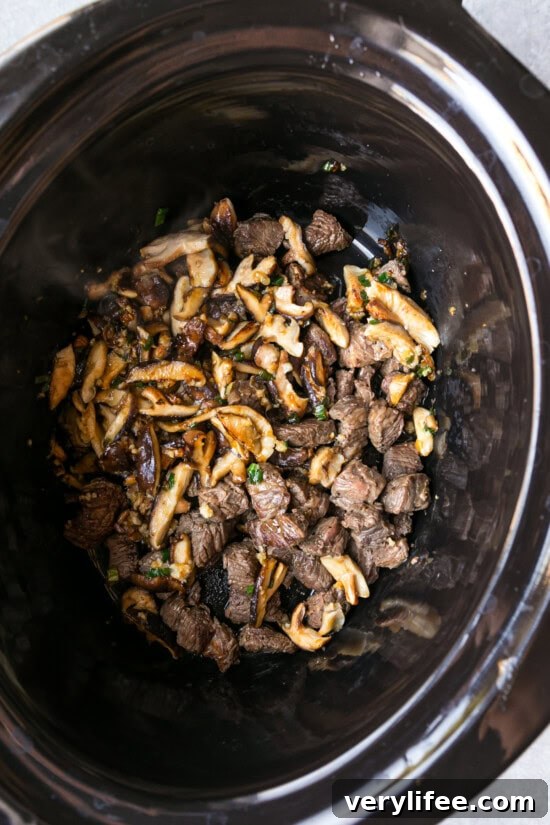 Slow Cooker Ramen Recipe: Rich Savory Broth and Tender Noodles 7 Add mushrooms to the crock pot with beef.