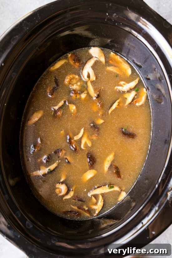 Slow Cooker Ramen Recipe: Rich Savory Broth and Tender Noodles 8 Add broth and soy sauce.