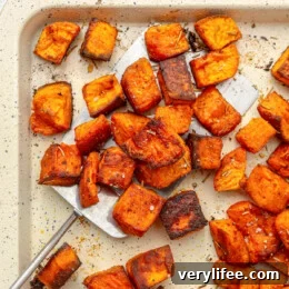 Crispy Pork Milanese with Kale and Apple Salad 10 Roasted Sweet Potatoes on a baking sheet.