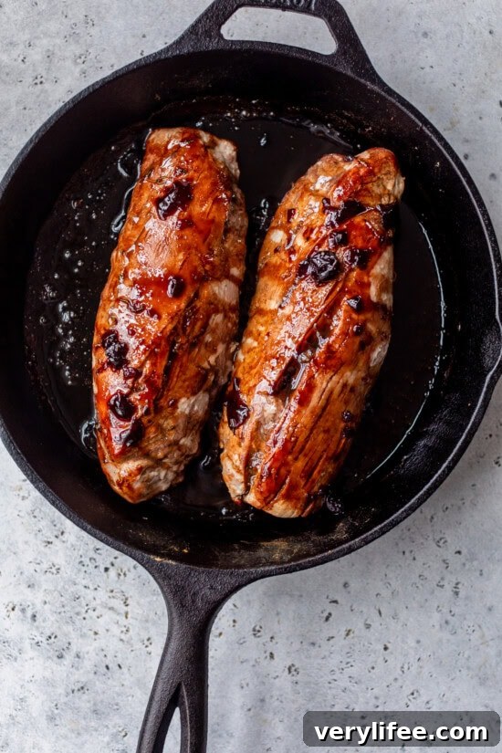 Cherry-Glazed Pork Tenderloin Recipe 8 Top with half of the sauce and roast in the oven until the pork is cooked.