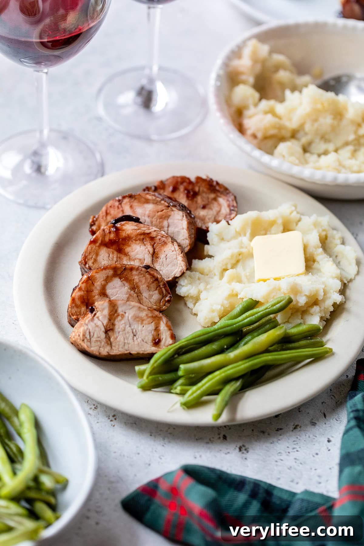 Cherry-Glazed Pork Tenderloin Recipe 9 Pork Tenderloin with Cherry Sauce, mashed potatoes and green beans.