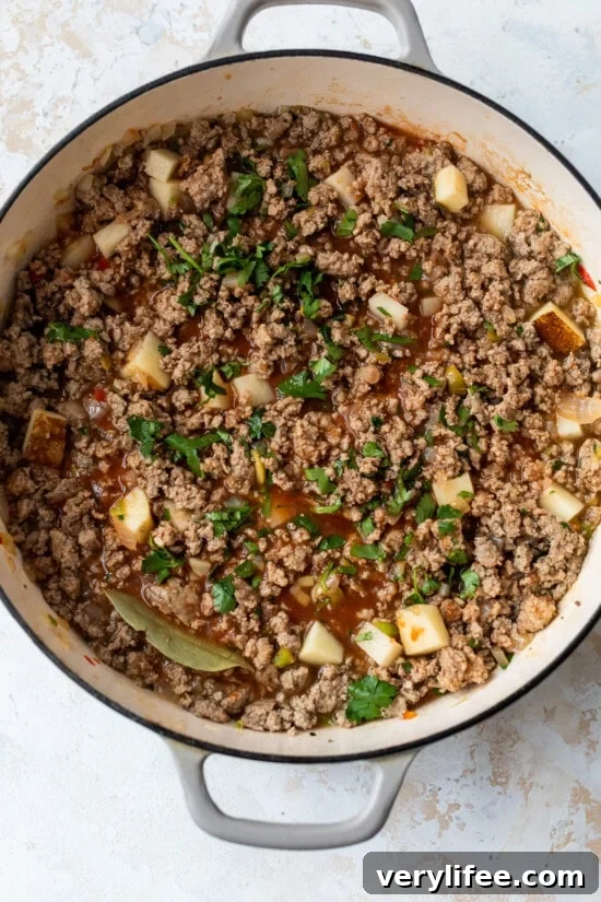 How to Cook Ground Beef Perfectly 7 Add potatoes, water and bay leaf and simmer until tender.