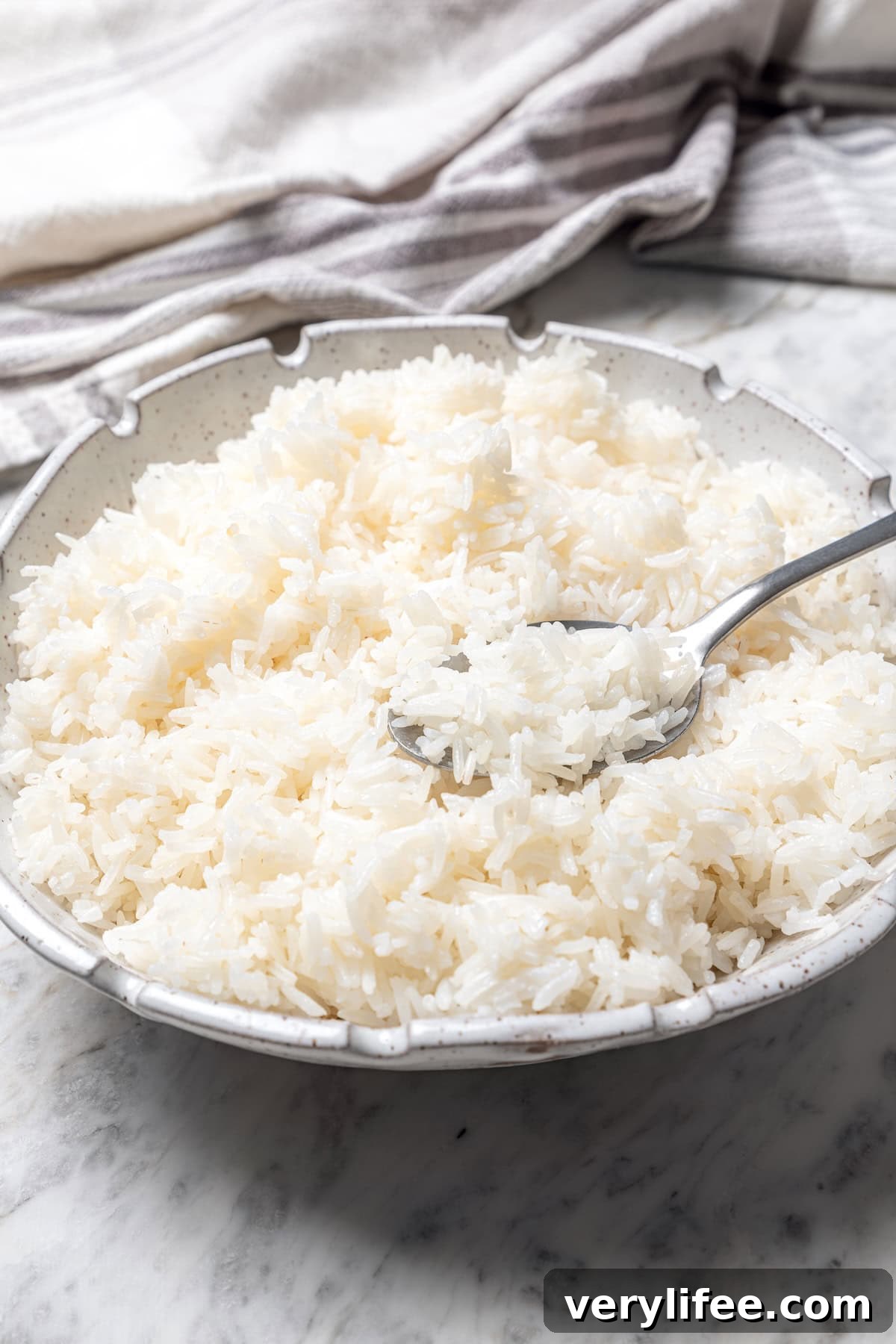 Bowl of jasmine rice with spoon