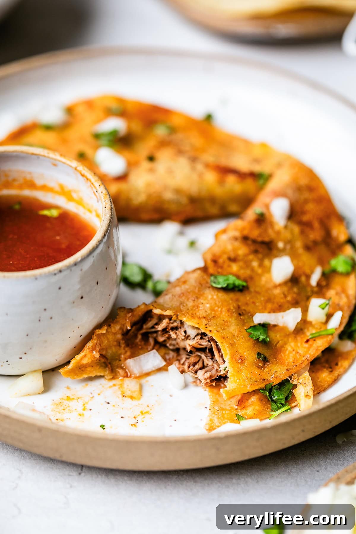 Slow Cooker Birria Tacos Recipe with Dipping Broth 12 Slow Cooker Birria Tacos Recipe