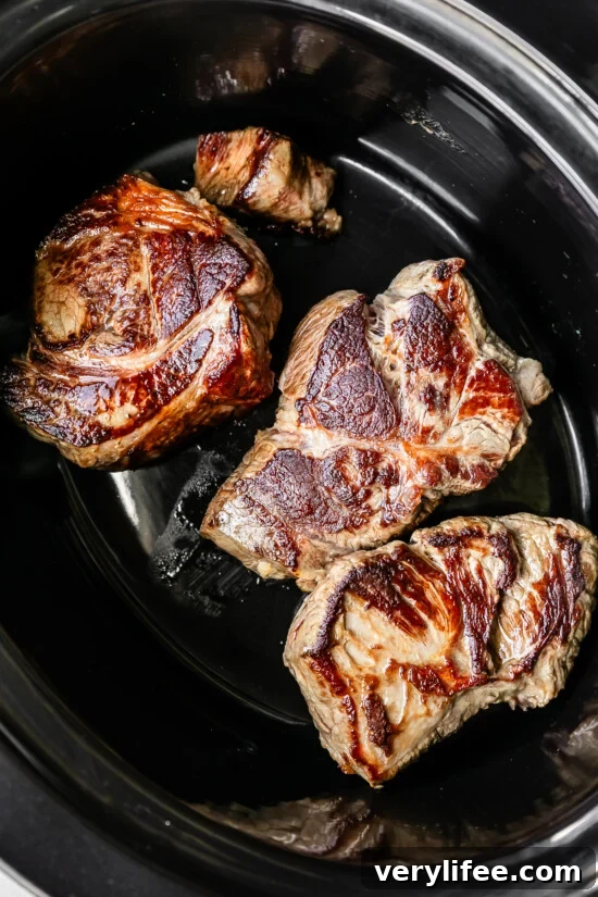 Slow Cooker Birria Tacos Recipe with Dipping Broth 6 Brown the beef