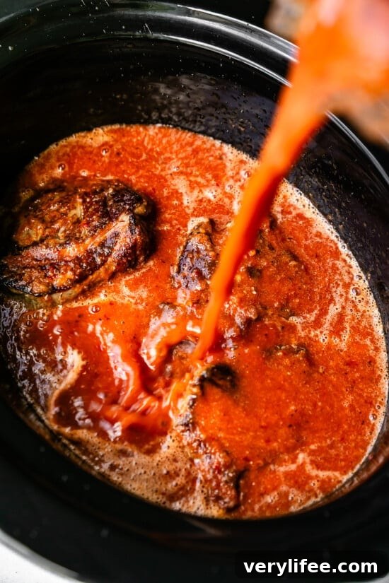 Slow Cooker Birria Tacos Recipe with Dipping Broth 8 Pour sauce into slow cooker with remaining ingredients