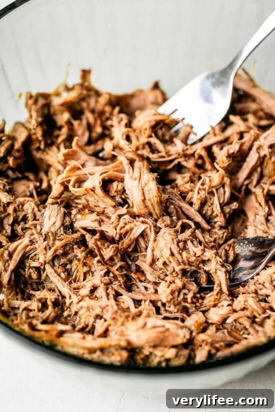 Slow Cooker Birria Tacos Recipe with Dipping Broth 9 shredded beef