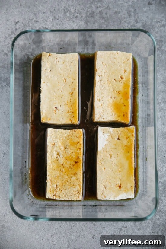 Crispy Pan-Seared Tofu Bowls with Ginger-Sesame Sauce 6 marinate tofu