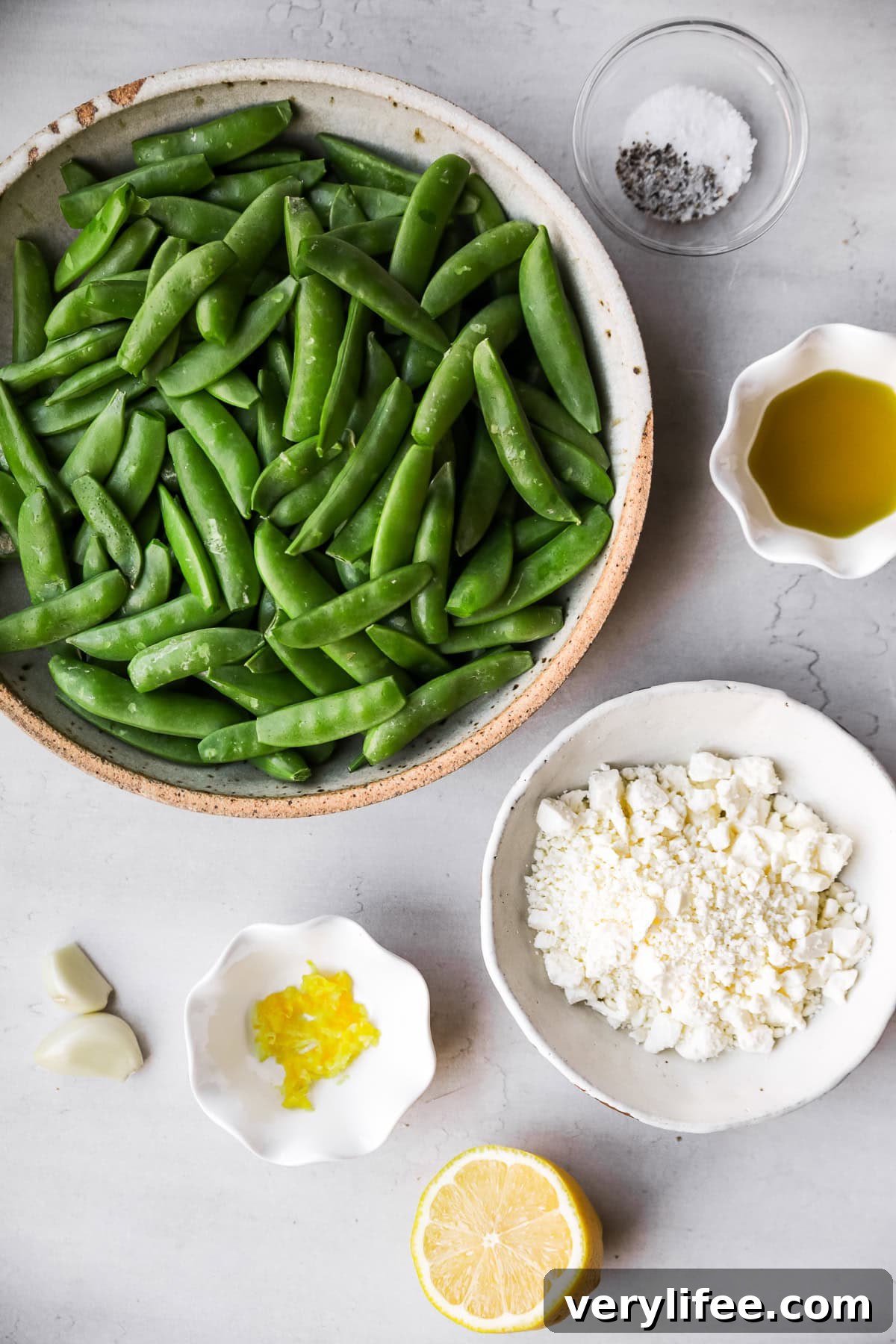 Charred Sugar Snap Peas with Garlic and Lemon 5 Snap Peas, feta cheese, lemon and olive oil.