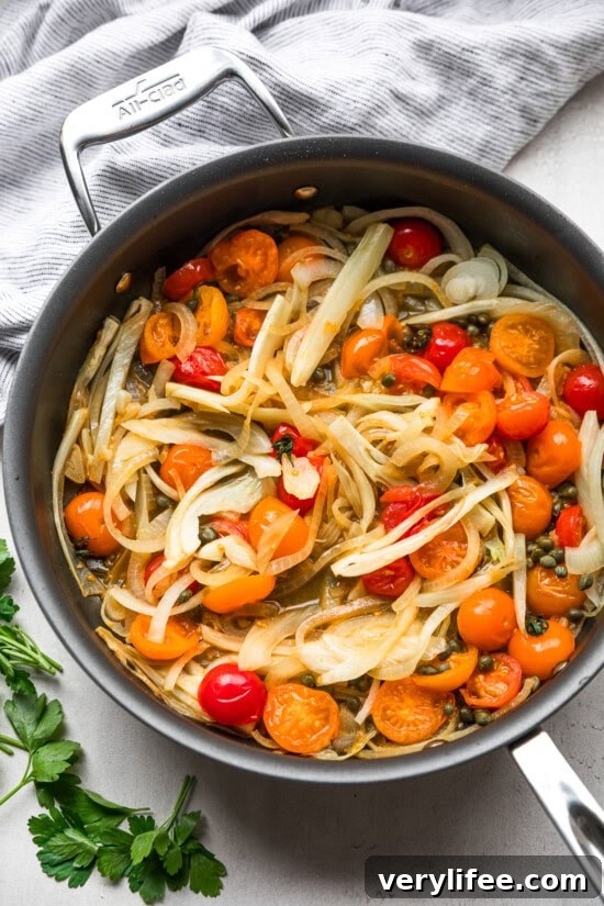 Crispy Lemon Garlic Oven-Baked Cod 7 fennel and tomatoes in skillet