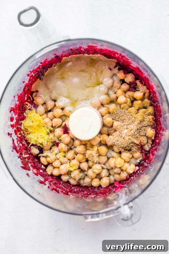 Vibrant Roasted Beet Hummus Recipe 7 beets and chickpeas in food processor