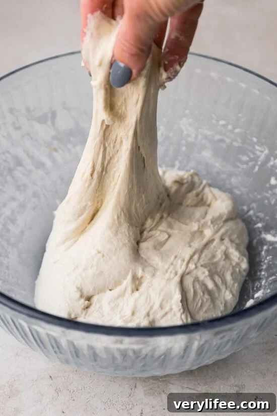 How to Make Classic Sourdough Bread at Home 11 Stretches and folds.
