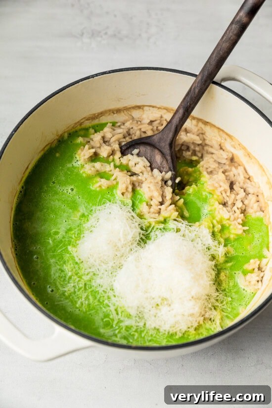 Creamy Oven-Baked Risotto Recipe with Parmesan and Mushrooms 9 Mix rice with peas and cheese.