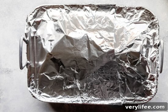 Honey-Glazed Spiral Ham Recipe 8 baking dish with foil