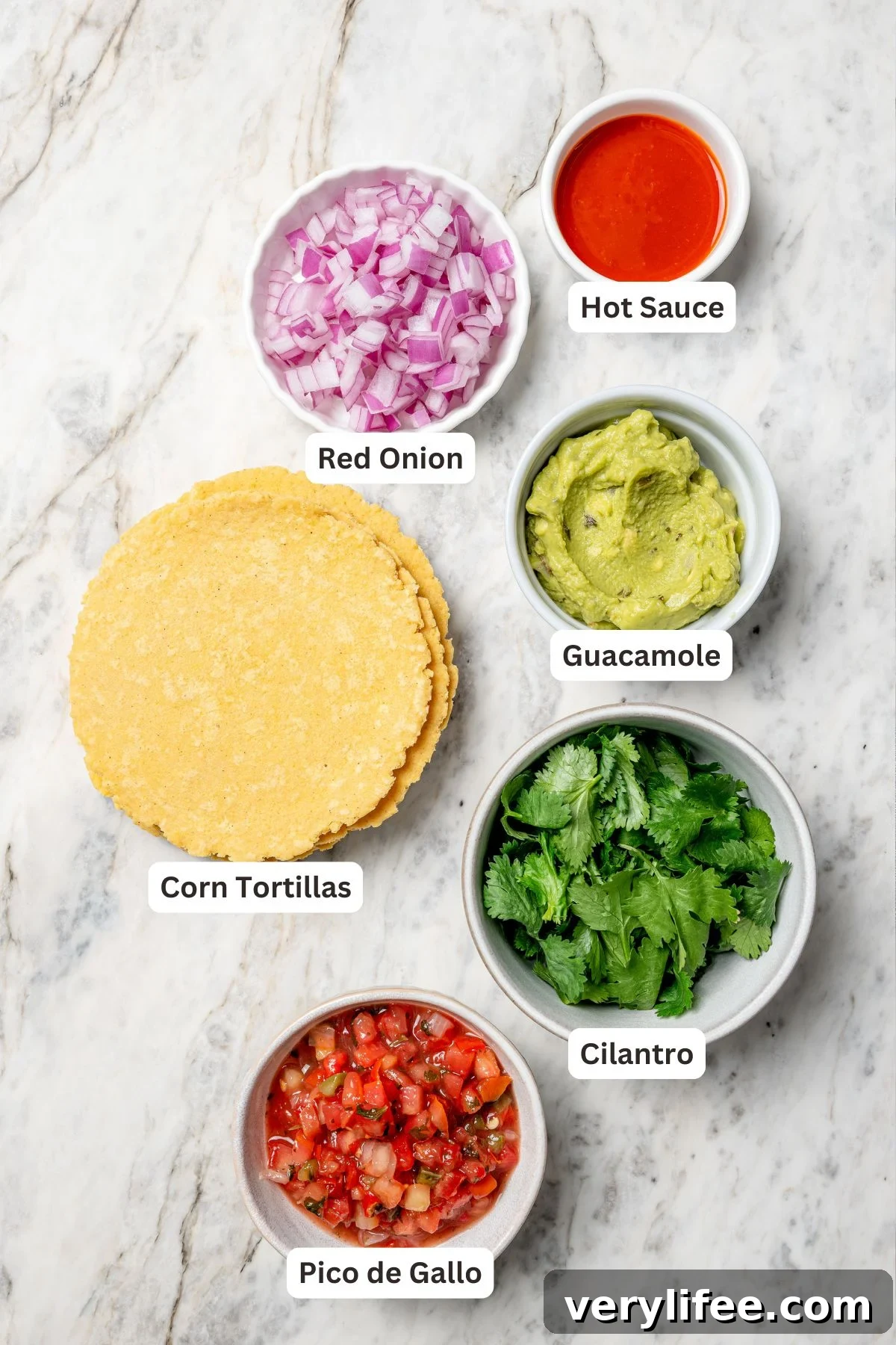 Vegan Lentil Tacos with Spiced Tomato Salsa 5 Overhead view of tortillas and toppings for lentil tacos