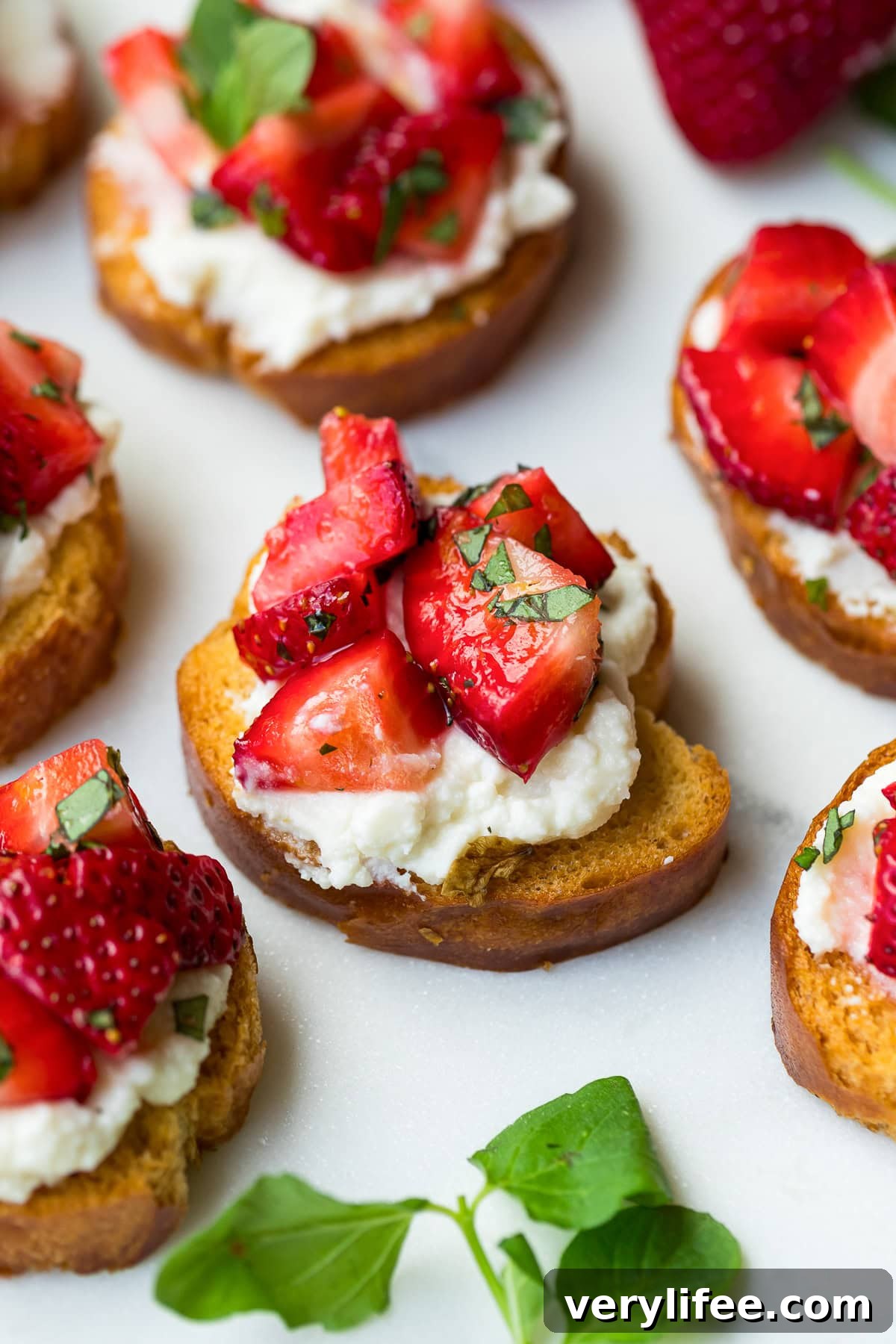 Strawberry Crostini Recipe with Goat Cheese and Balsamic Glaze 2 Strawberry Crostini with mint