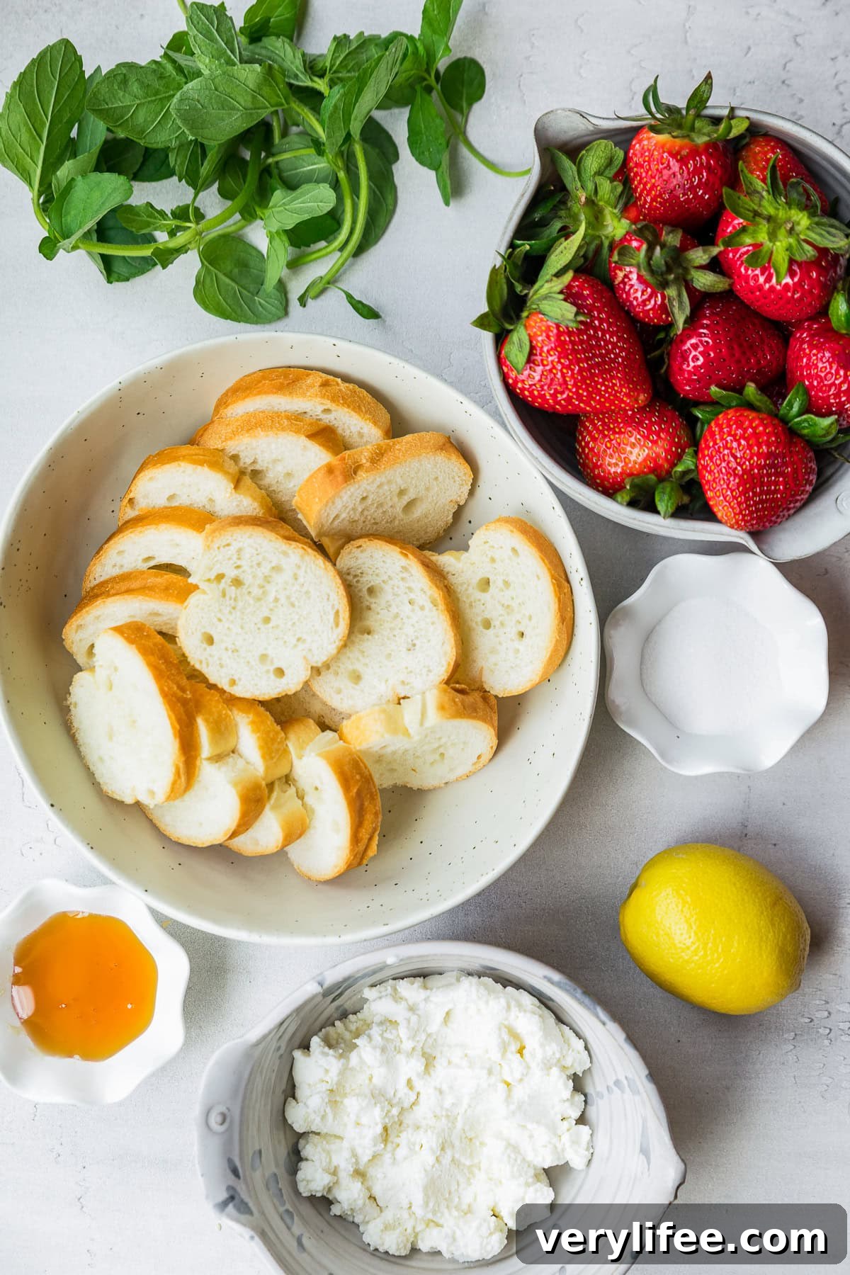 Strawberry Crostini Recipe with Goat Cheese and Balsamic Glaze 5 strawberries, toast, lemon, honey