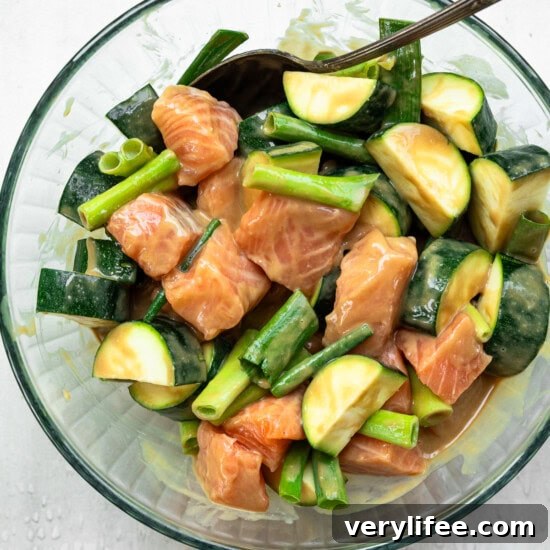 Grilled Miso-Glazed Salmon Skewers with Zucchini & Scallions 6 Miso marinade with salmon and veggies in a bowl