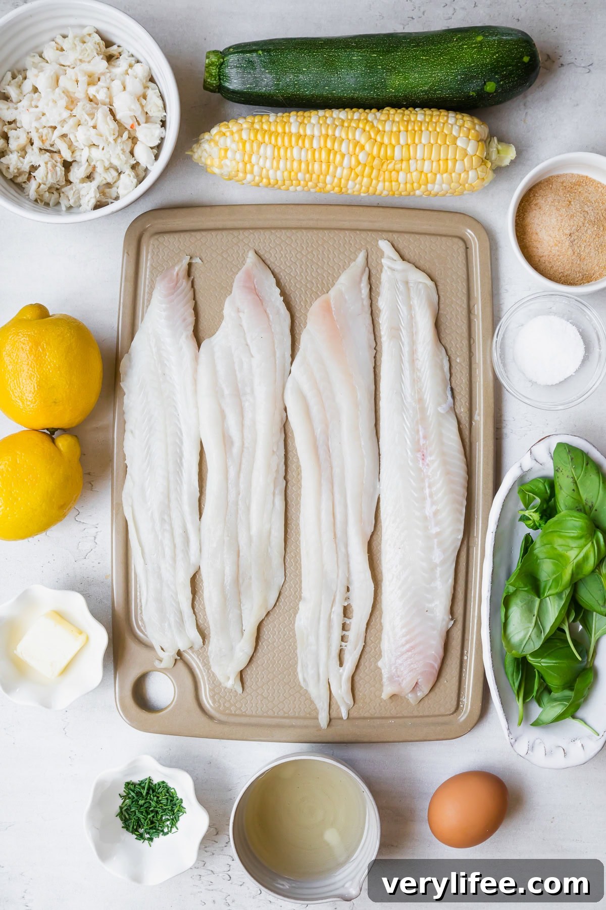 raw fish, corn, lemons and crab