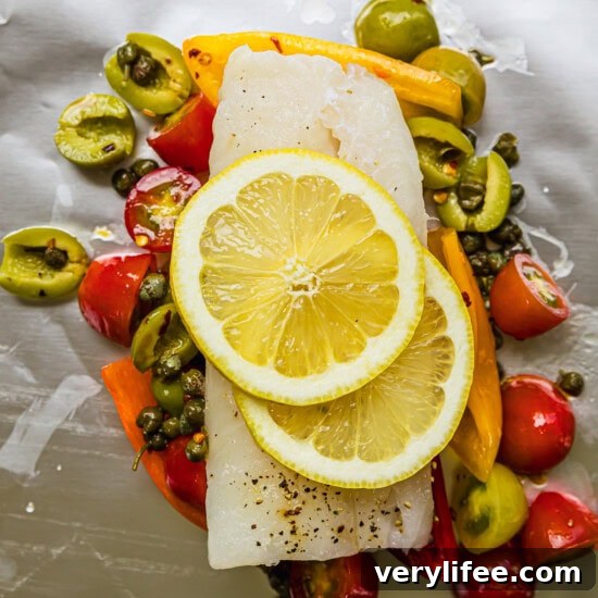 fish, lemons, olives and vegetables in foil