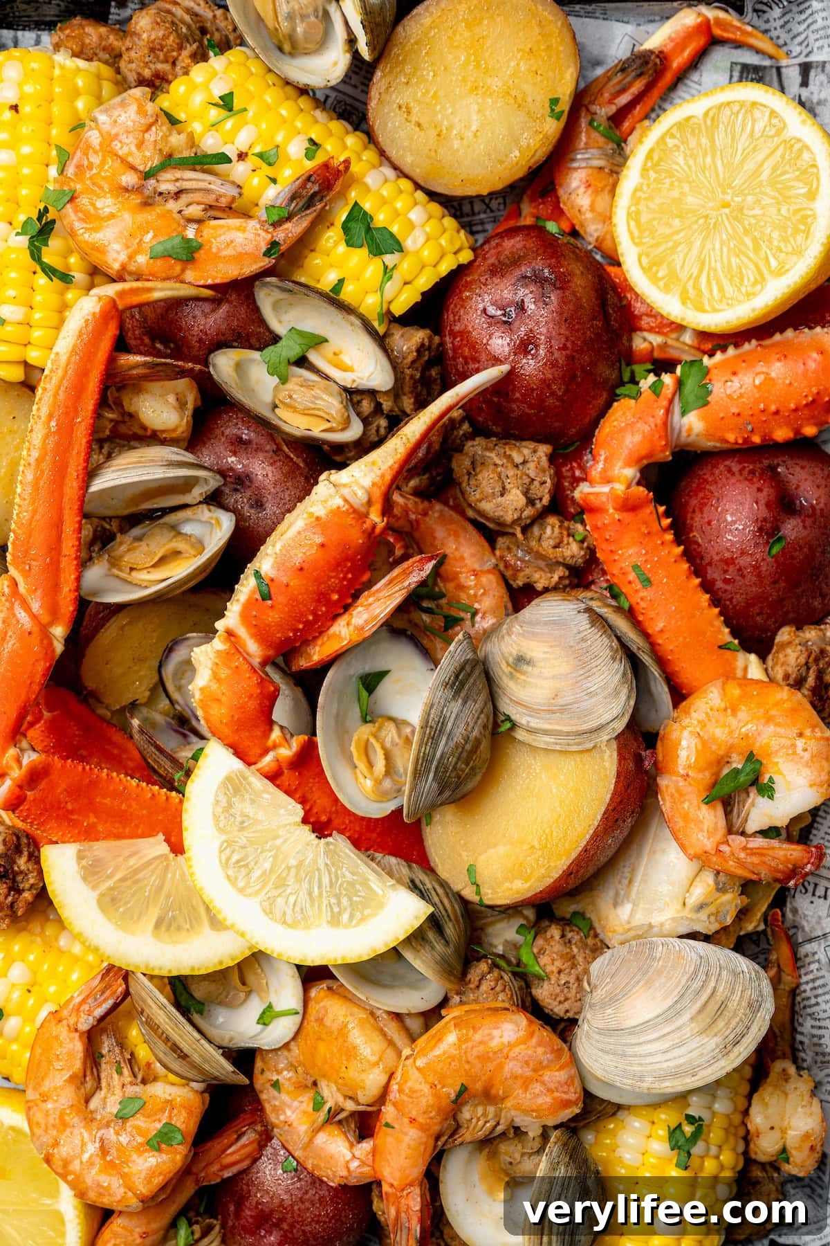 Overhead view of seafood boil with lemon slices