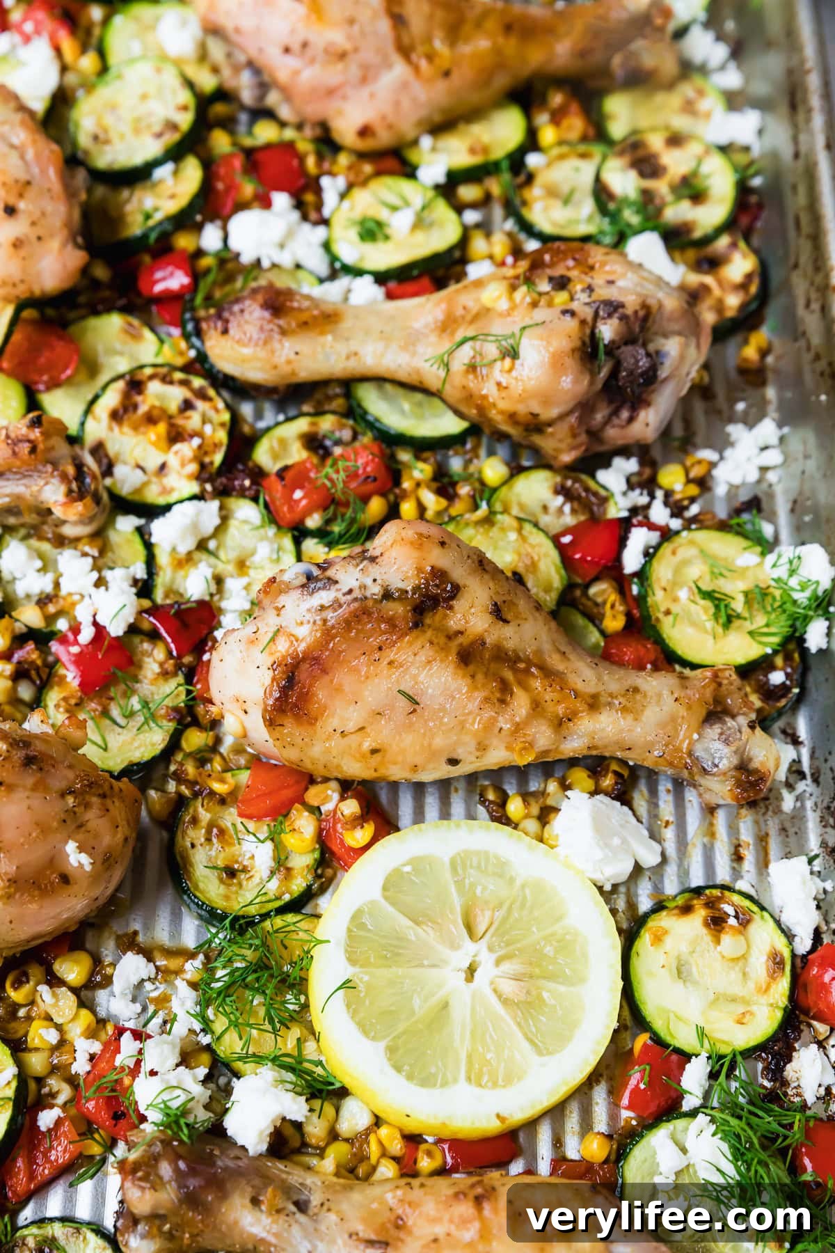Sheet-Pan Chicken Drumsticks with Zucchini and Corn Recipe 10 Sheet Pan Chicken Drumsticks with Zucchini, Lemon, Corn and Feta