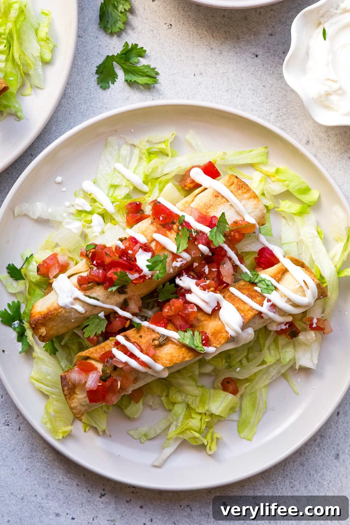 Crispy Chicken Taquitos with Avocado Crema 2 Chicken Taquitos