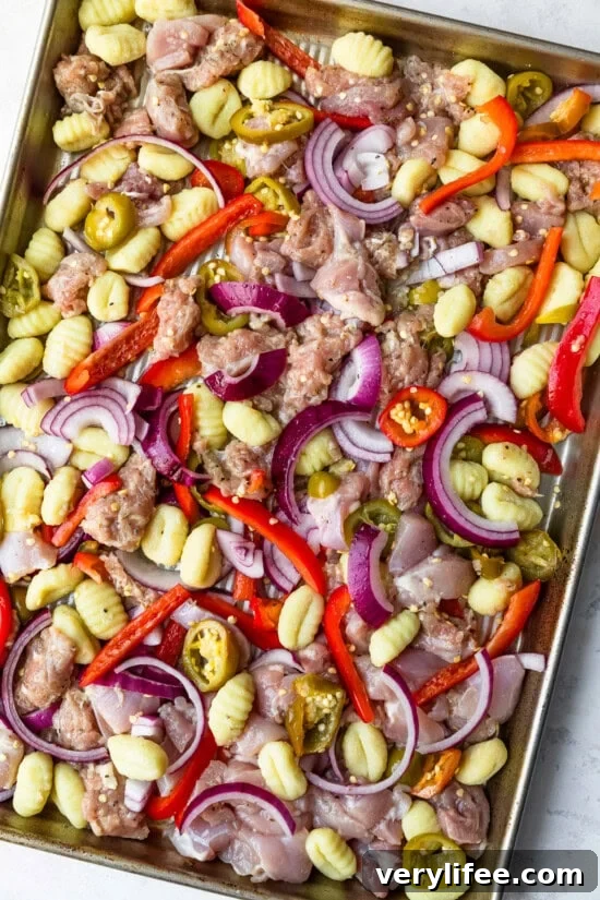 Crispy Sheet Pan Chicken Scarpariello with Peppers and Olives 6 Arrange everything on the prepared sheet pan.
