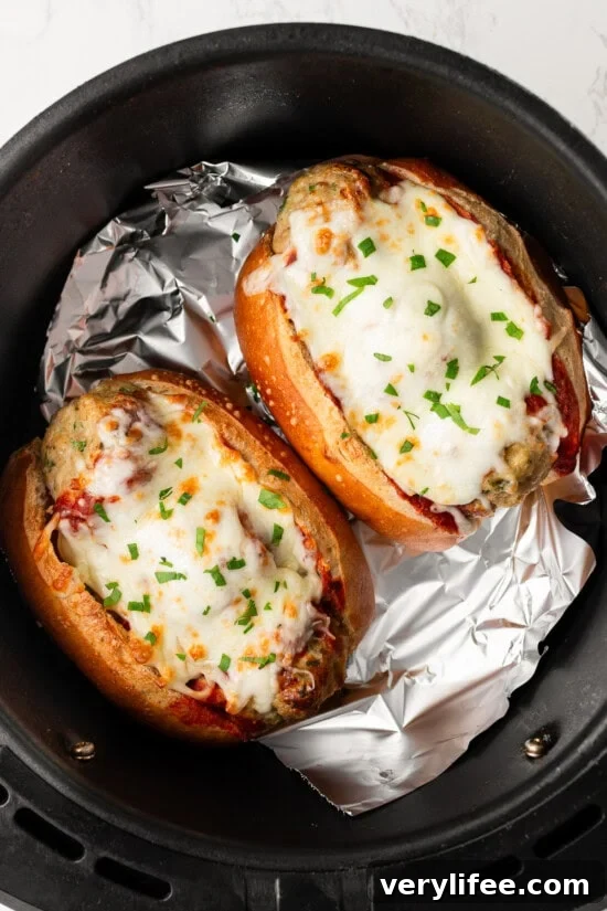 Crispy Air Fryer Meatball Subs with Melty Cheese 9 Air Fryer Meatball Subs in the air fryer basket