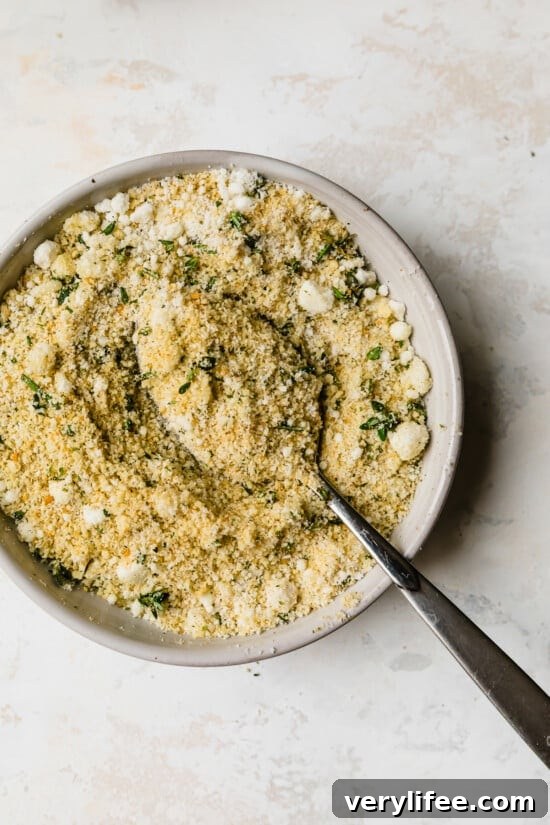 Mix breadcrumbs with grated cheese and herbs