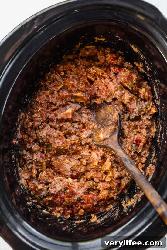 Crockpot Cheesy Taco Dip Recipe 7 combine beef with beans