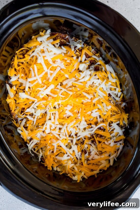 Crockpot Cheesy Taco Dip Recipe 8 Top with cheese
