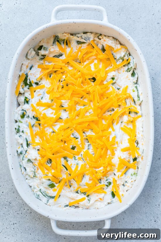 Pour the mixture into an 8x8-inch baking dish and top with cheese