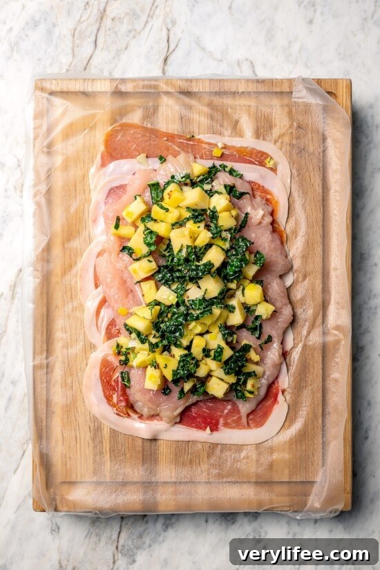 Prosciutto-Wrapped Turkey Tenderloin Stuffed with Apples, Kale 6 Kale and apple filling on turkey tenderloin.