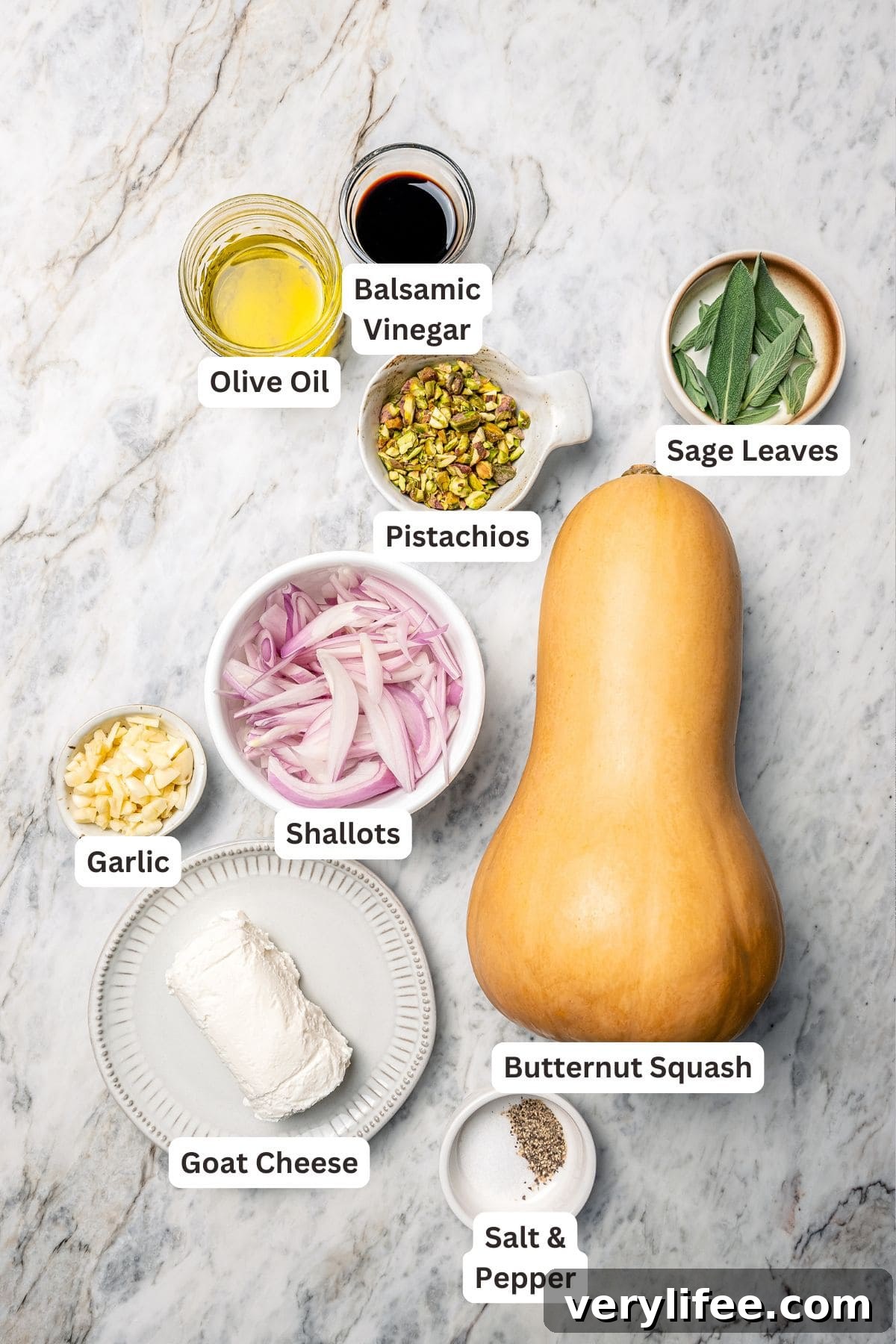 Ingredients for butternut squash bake with goat cheese and pistachios.