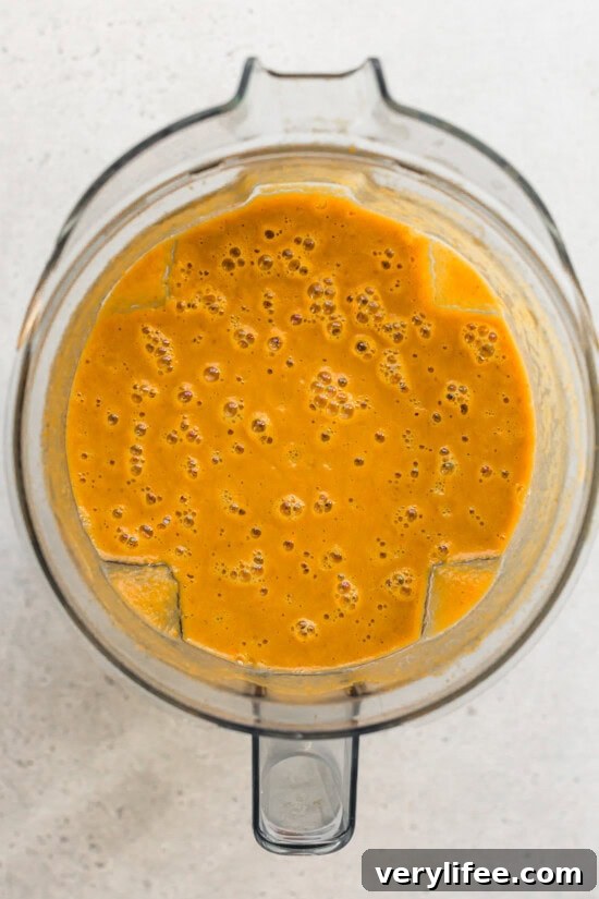 Creamy Pumpkin Ginger Coconut Soup — Dairy-Free 6 Easy pumpkin soup blended up in a blender.