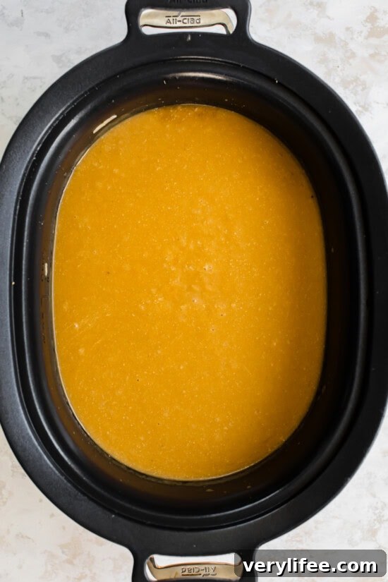 A cozy butternut squash cheddar soup in the slow cooker