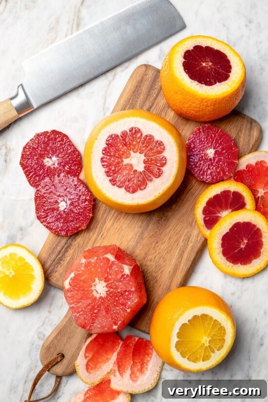 Roasted Beet Salad with Citrus and Goat Cheese 8 Sliced citrus fruit on cutting board next to knife.