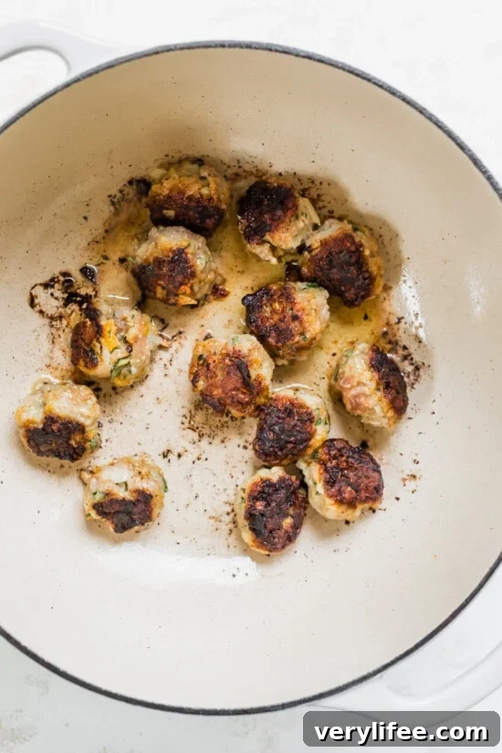 Hearty Tuscan White Bean Soup with Savory Meatballs 8 brown the meatballs