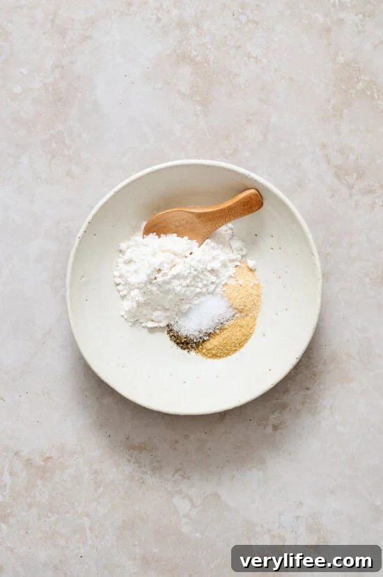 Combine flour and seasoning